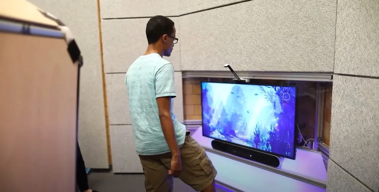 A student at the Ouva media wall in the sensory hub at Lane Tech High School, Chicago